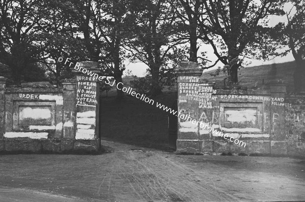 GATEPOSTS WITH POLITICAL SLOGANS WRITTEN ON THEM